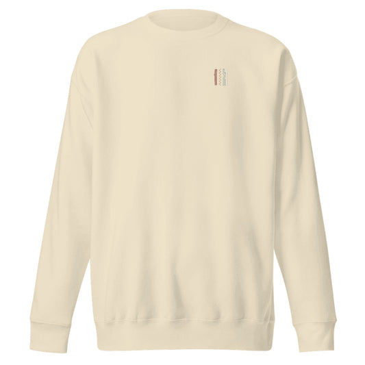 Four Strokes Mini Mark Crewneck mockup: Cotton Heritage M2480 in Bone with the small muted four-stroke 1111 mark on the left chest